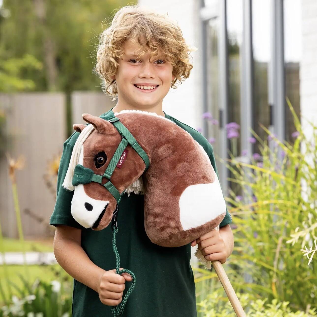 Young horse lover with a LeMieux hobby horse